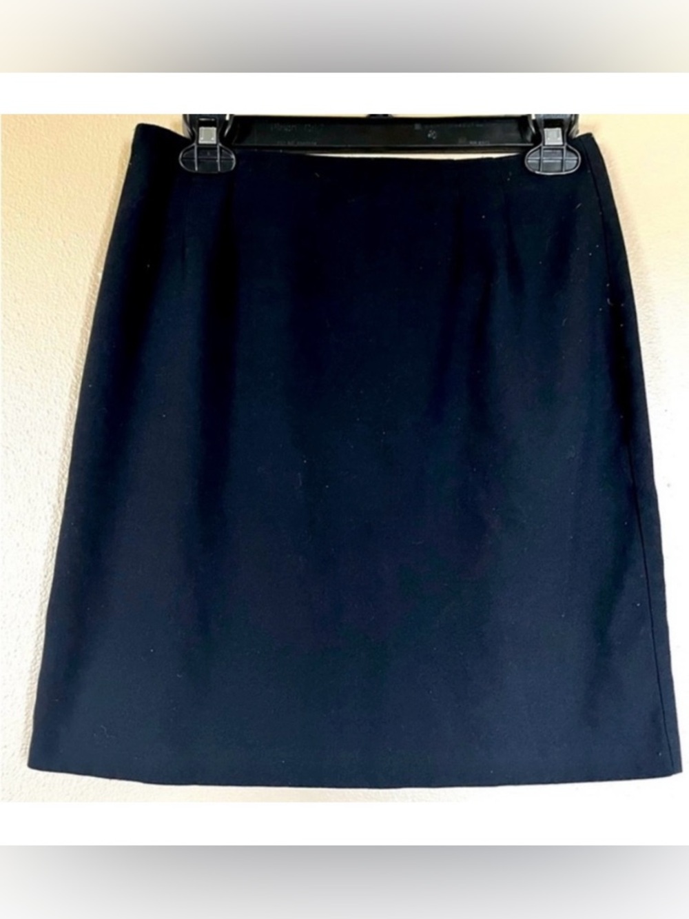 Black A-line knee length skirt, zips in back. Elegant. Women’s size 10.